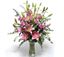 Picture of Pink long stemmed roses and oriental pink lilies in a bed of eucalyptus leaves.