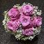 Picture of Wedding bouquet with  pink roses, baby breath, silver wire and pearls.