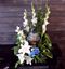 Picture of Farewell stunning  tall urn decoration with gladiola, white roses and more.