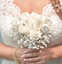 Picture of Wedding bouquet with white roses tucked in a bed of baby´s breath.
