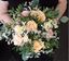 Picture of Wedding bouquet with a blend of peachy, pink and cream blooms.