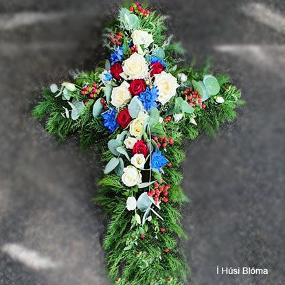 Picture of Beautifuly decorated Funeral Cross with white, red, blue flowers, berries and more