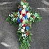 Picture of Beautifuly decorated Funeral Cross with white, red, blue flowers, berries and more