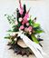 Picture of Danish style of Funeral Wreath standing on the floor with white lilies, pink gladiolus and roses and more-3 sizes.