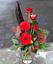 Picture of Valentine's  bouquet with red long stemed roses and gerbera daisy, greenery and heart..