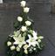 Picture of Flower arrangement with white roses, white lilies, baby breath and more.