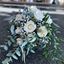 Picture of Bohemian chic wedding bouquet with white roses, baby's breath and different types of eucalypthus.