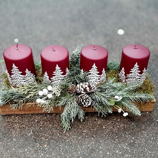 Picture of Beautiful advent arrangement in light wood tray with artificial greenery and wine red painted candles..