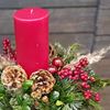 Picture of Gorgeous Christmas arrangement with red pillar candle