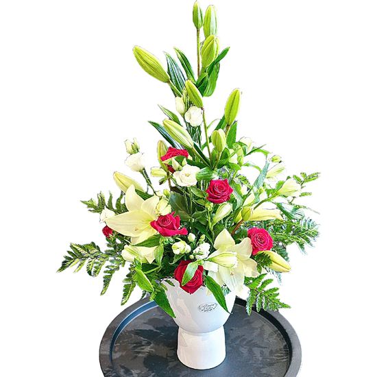 Picture of Classic display of white and red flower arrangement  in a white vase