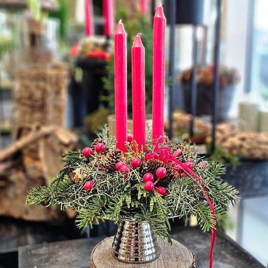 Picture of An elegant Christmas mix greenery and pine cones arrangement with 3 candles on silver tray.