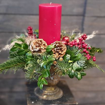 Picture of Stunning Christmas decoration with red pillar candle in antique vase