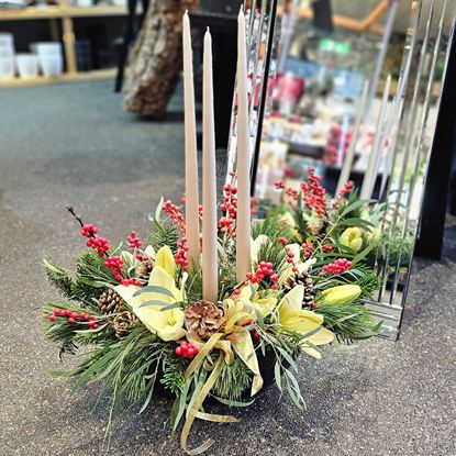 Picture of Luxurious Christmas centrepiece, with 3 candles, Christmas greenery, white lilies, red berries and more.